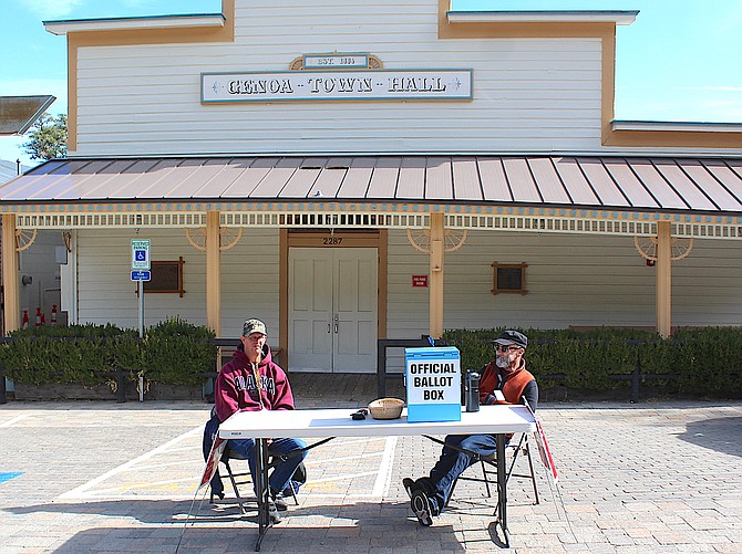 Poll workers attend the ballot box in Genoa, Nevada's oldest voting precinct on the Nevada Day holiday.