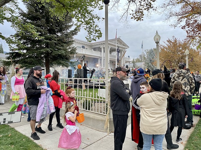 A line of revelers waiting to get into the Governor’s Mansion on Monday.