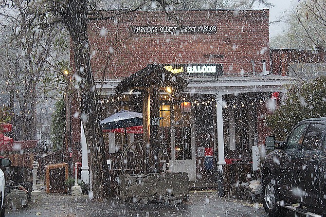 Patrons of Nevada's oldest thirst parlor took shelter inside on Monday afternoon as heavy wet snow fell around 4:30 p.m. It was too warm to accumulate, but it was not too shabby for a storm that wasn't supposed to do that much.