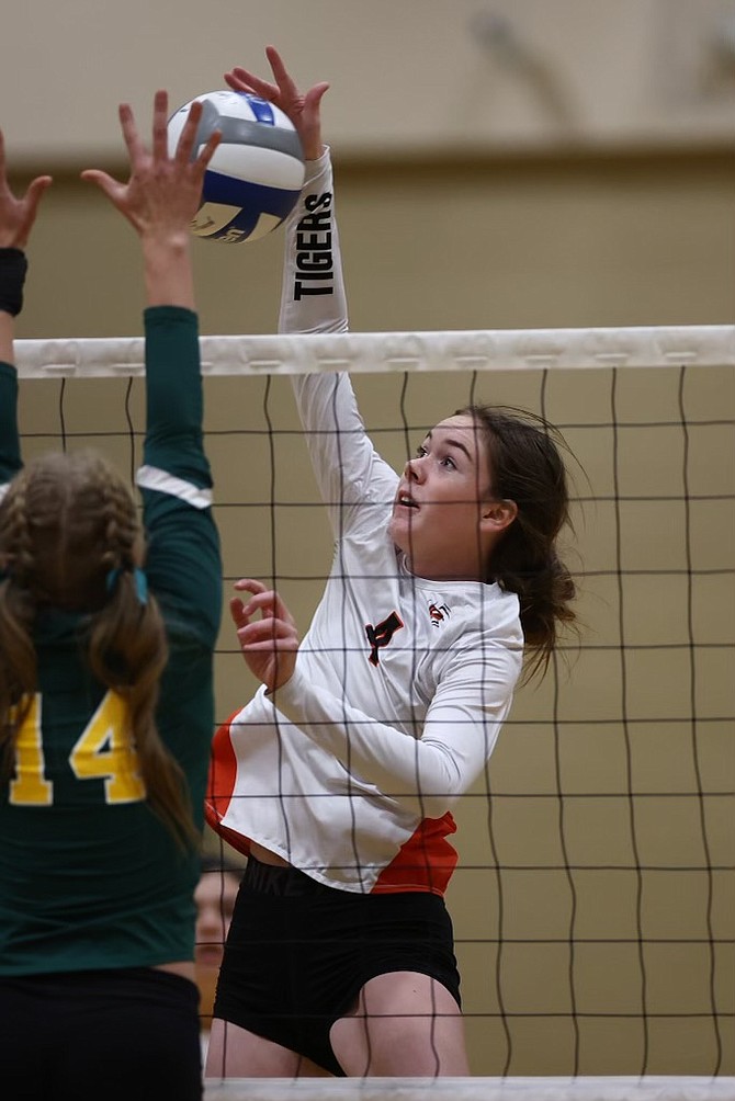 Douglas High's Addy Doerr (4) goes up on the attack at Bishop Manogue Wednesday evening, during the Class 5A North regional semifinals. Doerr, a senior, had five kills in her final game with Douglas volleyball.