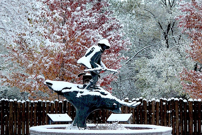 The statue of Snowshoe Thompson in Mormon Station State Historic Park in Genoa has a little snow on it Thursday morning. There could be more coming early next week.