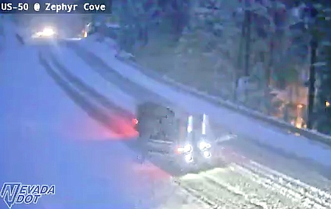 Snow is accumulating on Highway 50 at Lake level this morning.