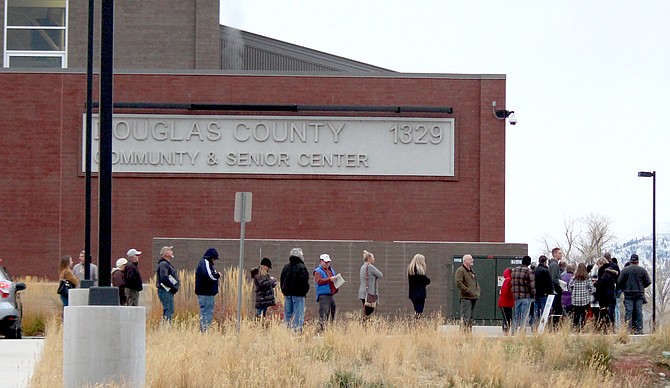 Voters line up at the Douglas County Community & Senior Center just after the polls open on Tuesday.