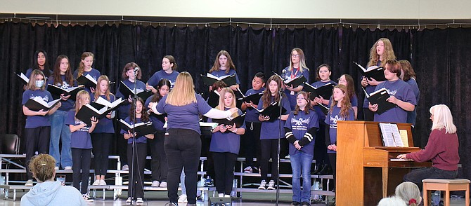The Carson Middle School choir performs a Veterans Day concert to give tribute to local veterans who have served in the U.S. military on Thursday with parents and family members attending.