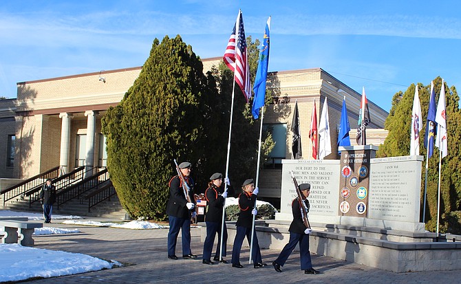 Members of the Douglas High Army Jr. ROTC Tiger battalion present the colors on Friday morning in Minden as part of a Veterans Day observance at the Douglas County Courthouse.