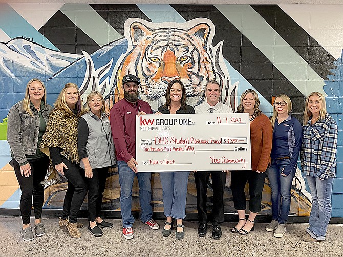 The Douglas High School Assistance Funds received a $2,350 check Monday from First American Title, Keller Williams and Carson Valley Accounting. Deanna Sorhouet,  Cynthia Failor, Natalie Dufty, Ryan Blaver, Vanessa Ozolin’s, Principal Mike Rechs, Emily Tobias, Brynn Nelson and Brandy Marshall.