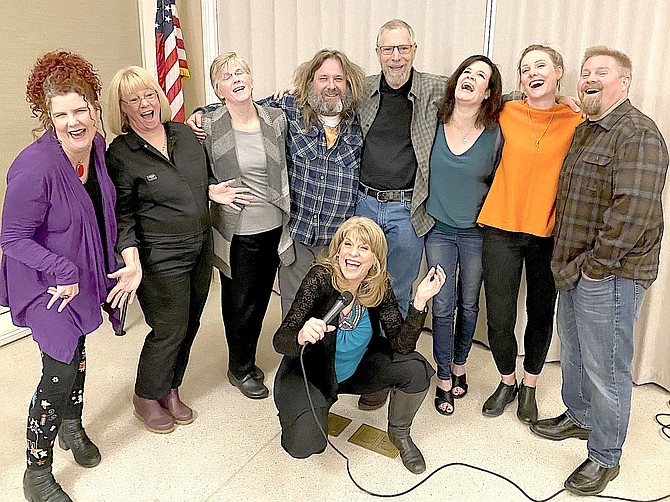 Kat Simmons, center, with six of her students, Katie Welsh, Laurie Harden, Tracey Anderson, Eric O'Meara, Jim Campbell, Enid Bailot, Lori Bell Herring, and Pierre Herring. Not pictured  is Darlene Pearson.