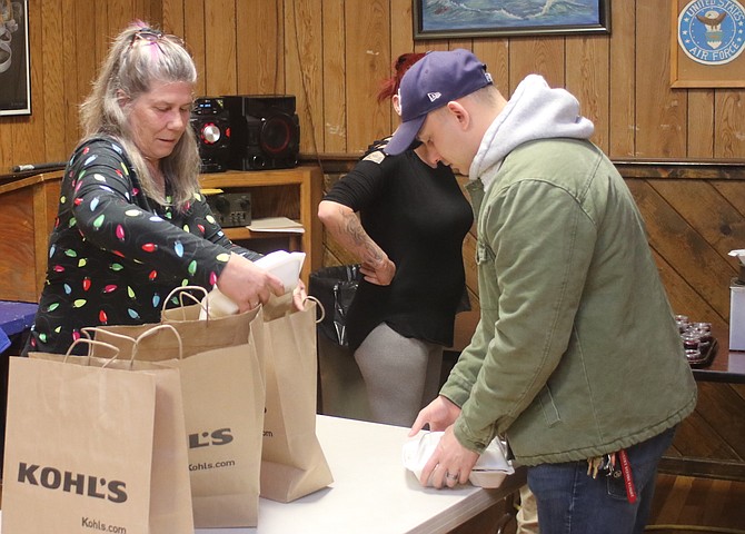 Volunteers prepare meals for delivery as part of the Wheels on Meals program conducted last year on Thanksgiving by American Legion Post 16.