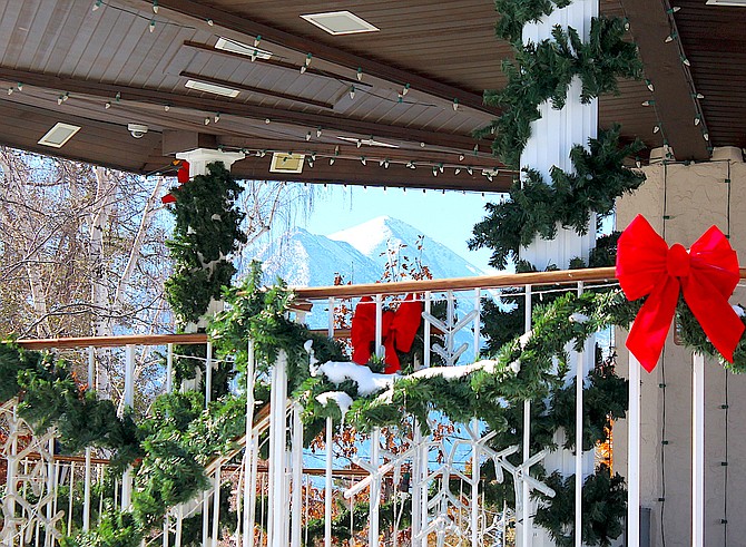 Jobs Peak is framed by the Minden Gazebo, which is decorated for the season. The Valley's Christmas events start Dec. 1 in Gardnerville with fireworks. Minden's Gazebo lighting and Genoa caroling are Dec. 2 and the Parade of Lights is Dec. 3.