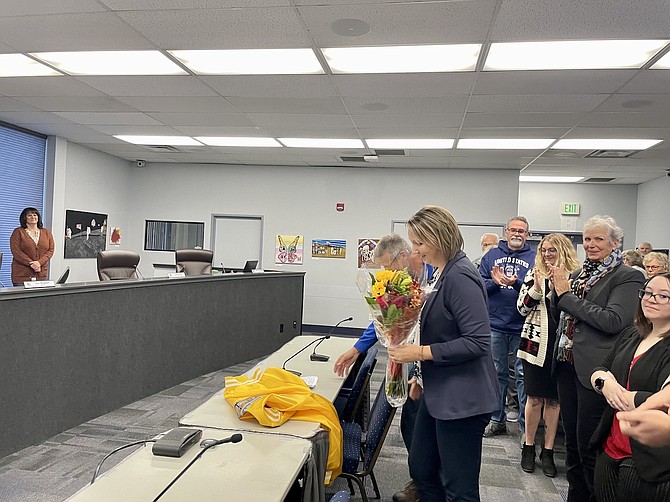 Carson City Clerk-Recorder Aubrey Rowlatt received flowers and a standing ovation Friday while presenting general election results for certification to the Board of Supervisors.