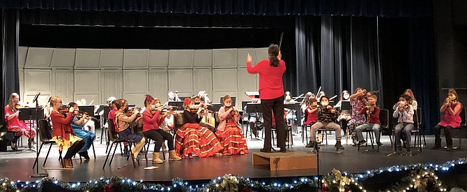 Associate concertmaster Laura Gibson conducting the Symphony Youth Strings concert in December 2021.