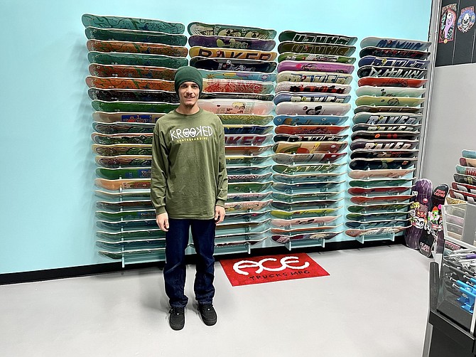 Esteban Carranza of Blissed Out Skate Shop in the Carson Mall on Nov. 21, 2022.