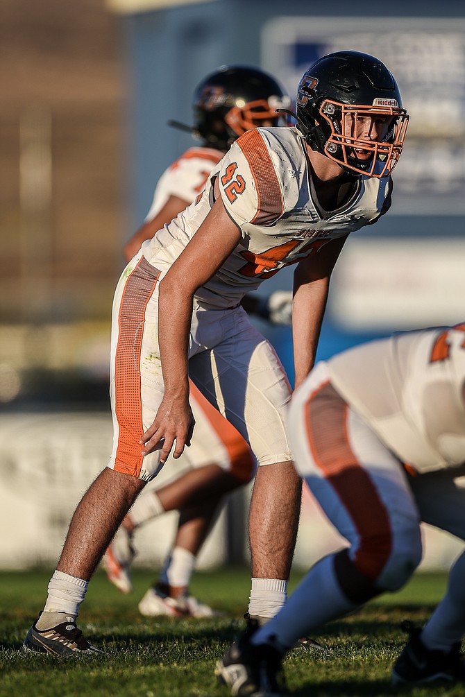 Douglas High’s Cole Smalley anticipates a play pre-snap for the Douglas High football team. Smalley was awarded first team recognition at linebacker on the 2022 Class 5A all-region football.