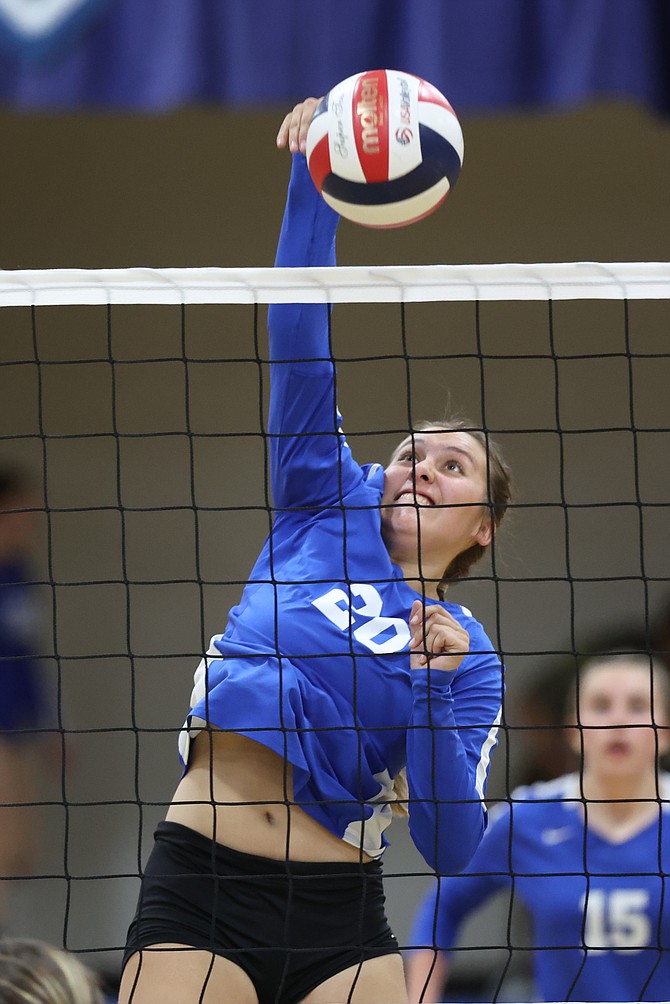 Carson High junior outside hitter Sarah Miller goes up for a kill against Galena in early October. Miller earned first team all-region honors in Class 5A for her play this past fall.