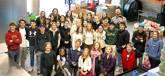 Douglas High School Block D students donated 1,985 pounds of food and groceries to the Carson Valley Food Closet Wednesday.