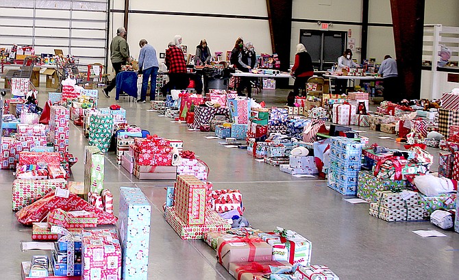 Wrapped presents stretch out across the Douglas County Fairgrounds floor during a previous Project Santa Claus.