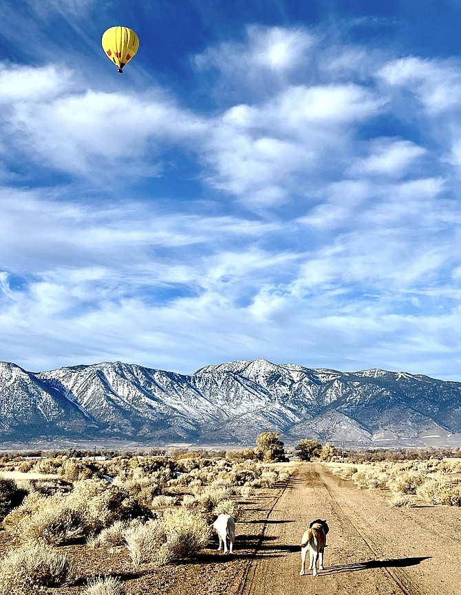 Linda Cambon caught this photo of the balloon soaring over the Valley with the Sierra.