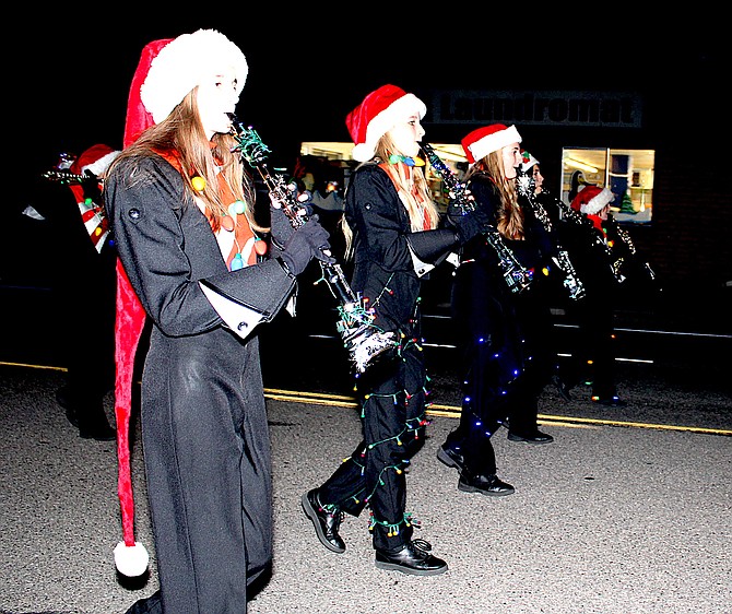 Members of the Douglas Tigers Marching Band participate in the 2021 Parade of Lights