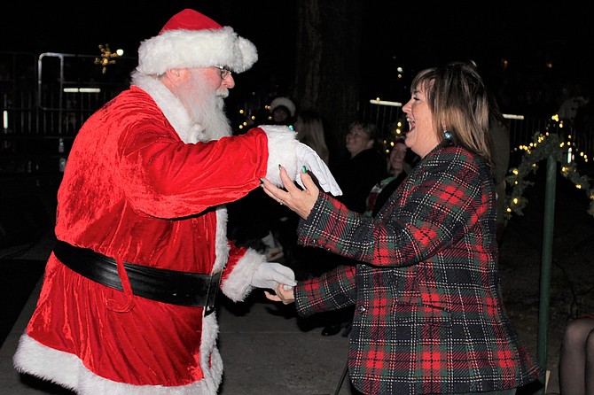 Santa Tom Bragg dances with Carson City Mayor Lori Bagwell during the 2021 Silver & Snowflakes Festival of Lights.