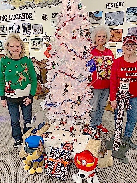 Nancy Kjeldergaard , Brenda Robertson and Gloria Darrington with the Douglas County Republican Women Christmas tree at the Carson Valley Museum & Cultural Center.