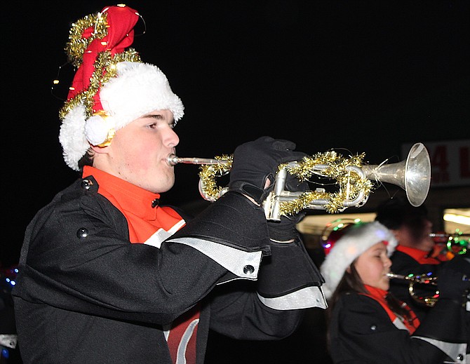 A member of the Douglas High School Marching Band brass section performs during the 2021 Parade of Lights in Gardnerville.