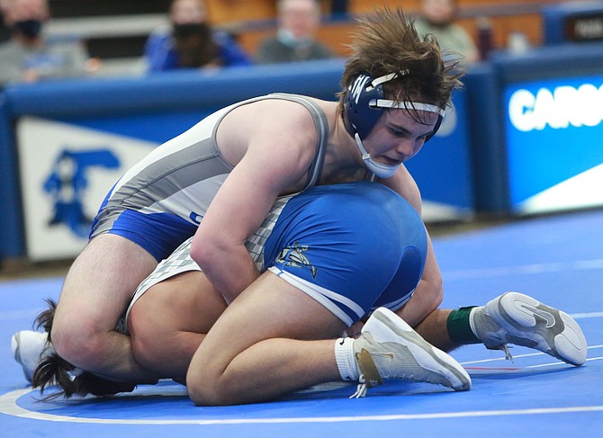 Jon Barnes-Hurt works atop an opponent during a match last season. Barnes-Hurt is one of five returning all-region wrestlers to a loaded Carson High lineup this season.