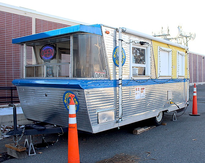 The Lions Trailer is parked in front of Frontier Communications in Minden.