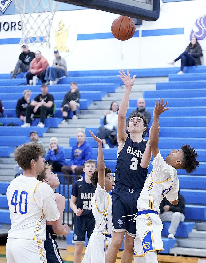Oasis Academy’s Fenn Mackedon shoots against Reed’s JV team in Saturday’s tournament. The Bighorns, who currently play in the 1A, will move up to the 2A next year after their appeal to stay in the 1A was denied.