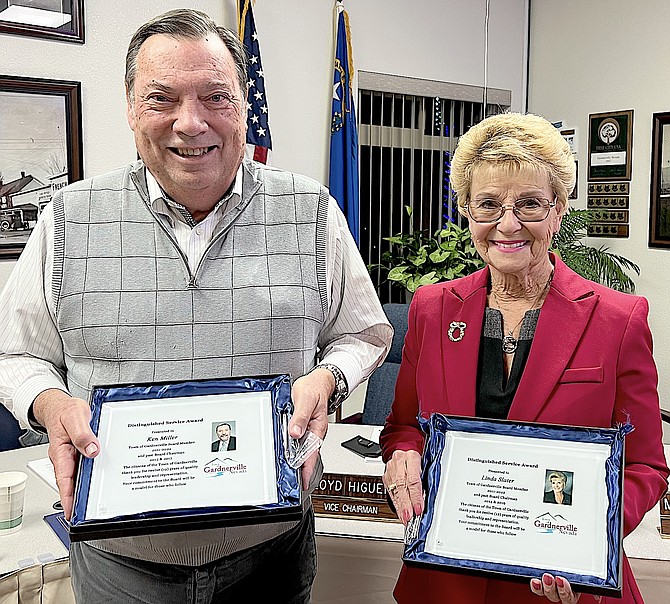 Gardnerville Town Board members Ken Miller and Linda Slater hold their plaques on Tuesday.
