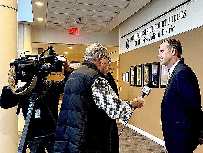 Washoe County District Attorney Chris Hicks is interviewed outside of Carson City District Court after District Judge James Wilson ruled the Pardons Board didn't have the authority to commute the sentences of death row inmates to life in prison without parole.