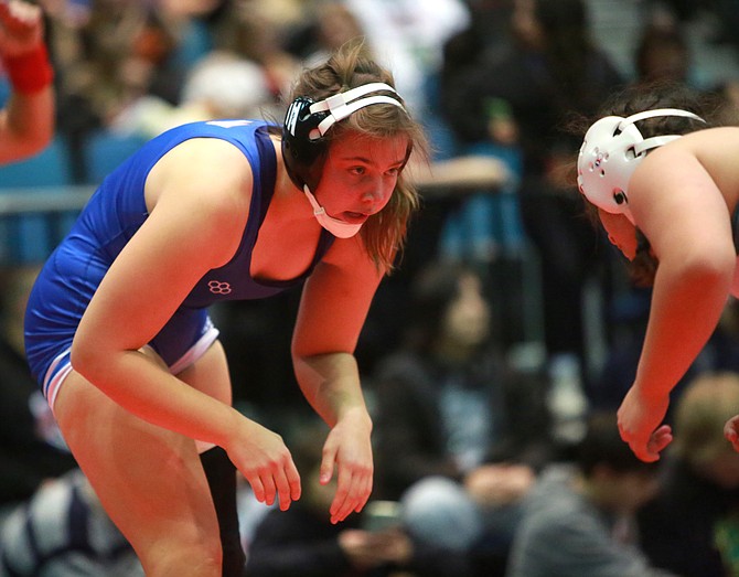 Carson High’s Ellah Olson circles her opponent from Hug High on Saturday at the Reno Events Center during the 152-pound girls final at the Reno Tournament of Champions. Olson became the first female wrestler in Carson High history to win her bracket at the TOC.