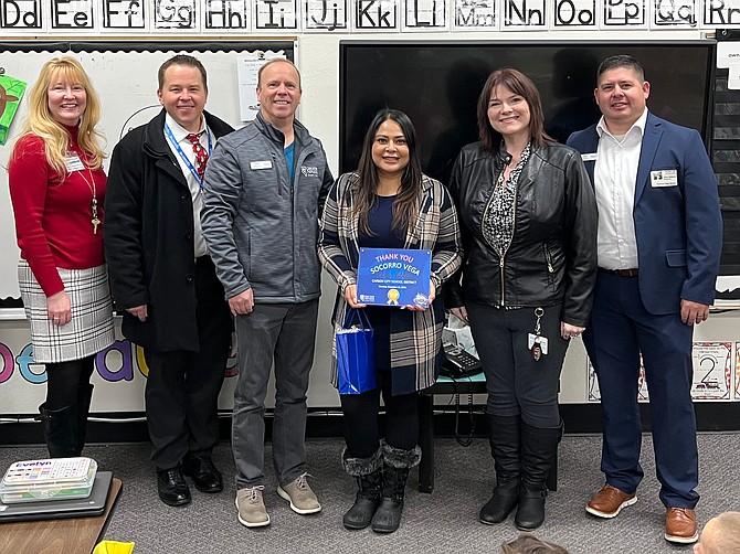 Greater Nevada Credit Union and Carson City School District workers gather for a photo, including Paula Zona, Carson City School Superintendent Andrew Feuling, Chris Holland, Socorro Vega, Merri Pray and GNCU’s John Ahdunko.