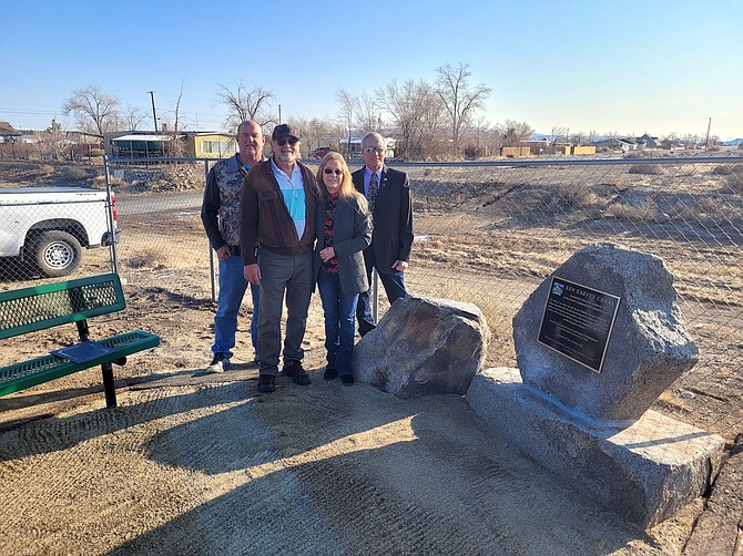 Lyon County Commissioners Rob Jacobsen, far left, Vida Keller and Dave Hockaday stand with Ron Harvey, son of late Commissioner Ken Harvey, during the Dec. 14 dedication ceremony to rename the Tahoe Avenue Storm Drainage Canal to the Ken Harvey Canal in Silver Springs.