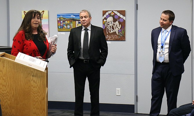 Trustee Stacie Wilke-McCulloch thanks the community as Board President Richard Varner and Superintendent Andrew Feuling honor her for her service as a Carson City School Board member on Dec. 13.