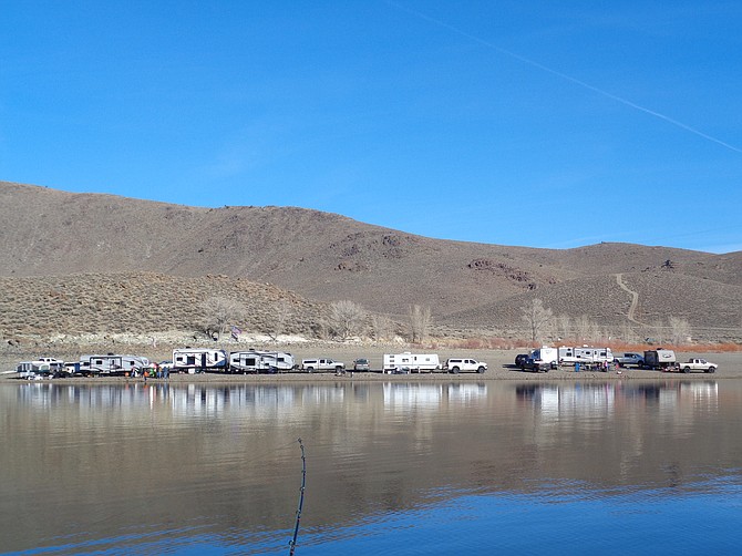 A fishing rod view of campers on the shore of Topaz Lake New Year’s Day 2022. Since fishing is now year around on the lake that straddles the Nevada-California line, opening day isn't what it used to be. Photo by Doug Busey