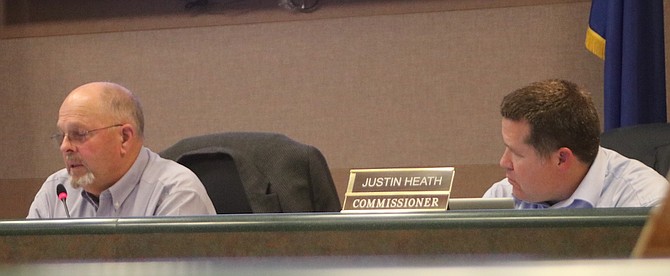 Commission Chairman Pete Olsen, left, makes a point during the discussion on the Fallon Range Training Complex at the last commission meeting of December while fellow Commissioner Dr. Justin Heath listens.