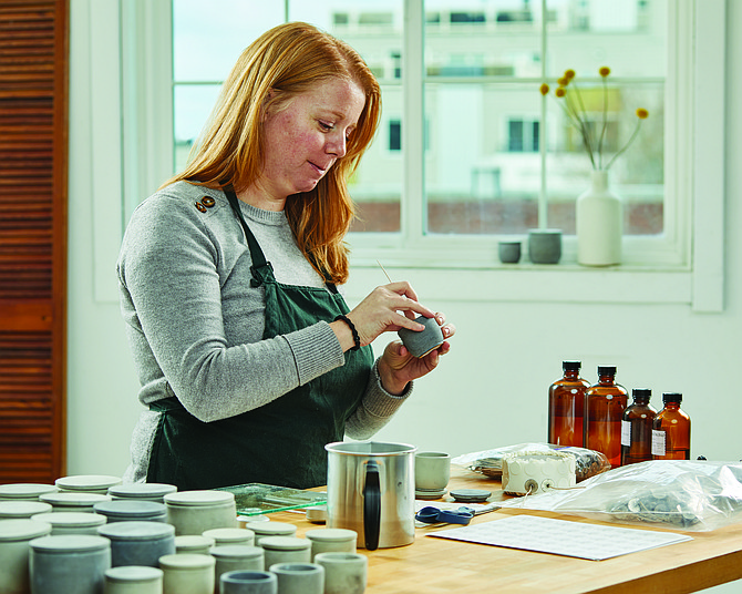 Shenalyn Castoldi makes candles in her Queen Anne home. When the pandemic hit, Castoldi learned how to make scented candles, which she turned into a business, Velle Candles.