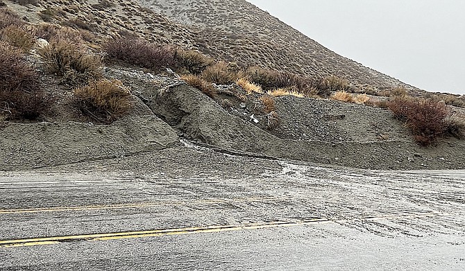 A rivulet washes dirt onto Foothill Road above Walley's Hot Springs south of Genoa on Tuesday morning. No Carson Valley roads or bridges were closed as a result of the rain storm.