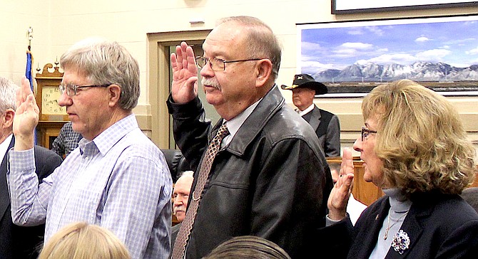 Gardnerville Town Board member Mike Henningsen and East Fork Fire Protection District Trustees Bernie Curtis and Barbara Griffin take the oath of office Jan. 7, 2019, in the courtroom of the Douglas County Courthouse. All three are among the elected officers who begin new terms in 2023.