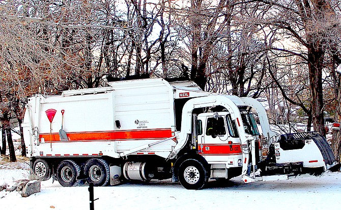 A Douglas Disposal truck makes its rounds in Genoa just before Christmas.