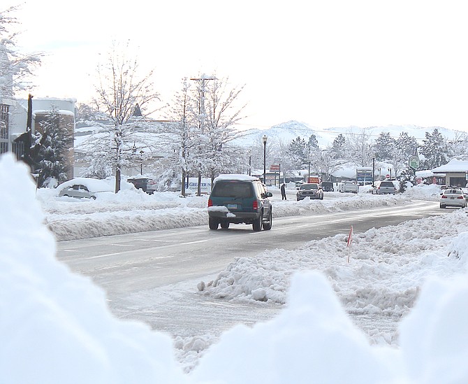A snow berm down the middle of Highway 395 through town.