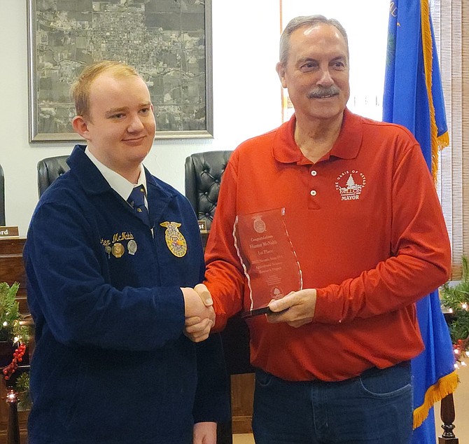 Hunter McNabb, left, receives an award from Fallon Mayor Ken Tedford.
