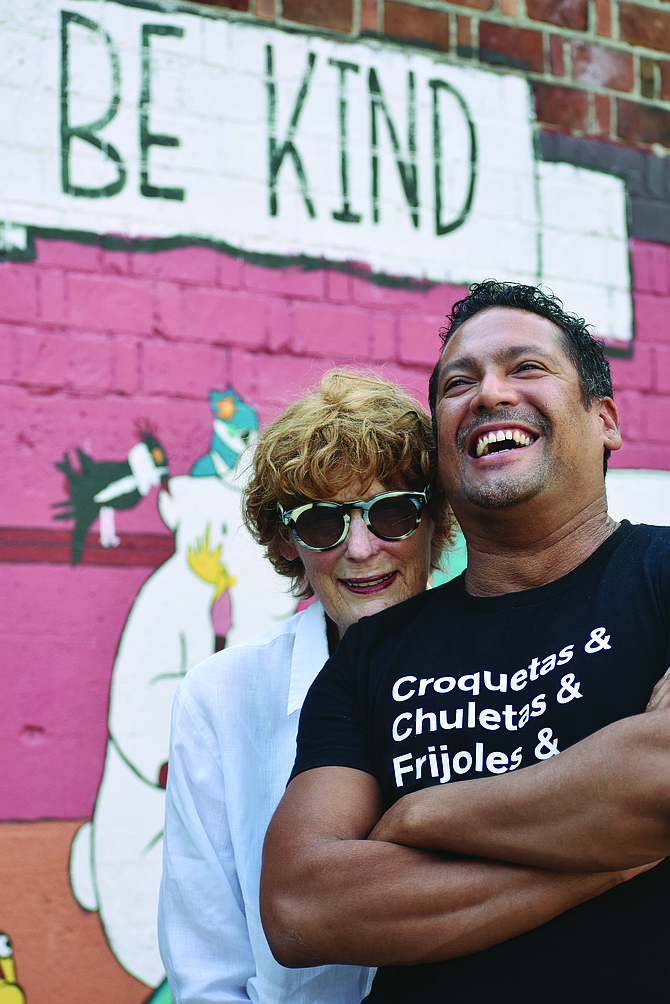 Gabriel-Bello Lawrence-Diaz, new executive director of Coyote Central, laughs with former program director and co-founder Marybeth Satterlee outside Coyote Central, at 2300 E. Cherry St., Seattle.