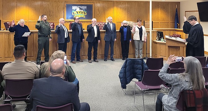 Left to right: Suzanne Prouty, Brad Pope, Steve Rye, Troy Villines, Scott Keller, Dave Hockaday, Anita Talbot and Staci Linberg take their oaths of office on Jan. 3, 2023.