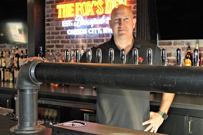 The Fox owner Jim Phalan shows off the new craft beer tower installed in the Fox’s Den.