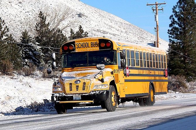 A Douglas County school bus travels down Jacks Valley Road after an early December storm.