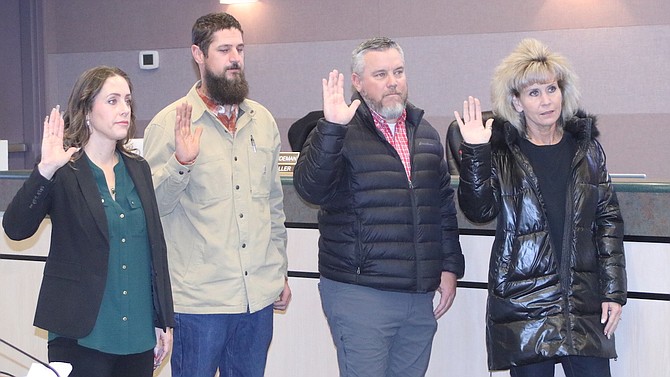 Taking their oaths of office for the Churchill County School Board on Jan. 3 are, from left, Amber Casey-Getto, Joe McFadden, Matt Hyde and Julie Guerrero-Goetsch.