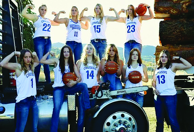 The Cruiser girls basketball team flexes during a photo shoot prior to the 2022-23 season.