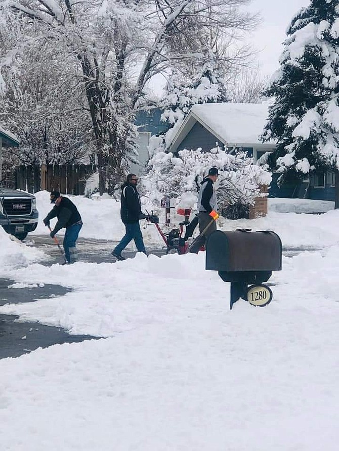 Neighbors helping neighbors in the Gardnerville Ranchos.
Photo by Pam Caughron