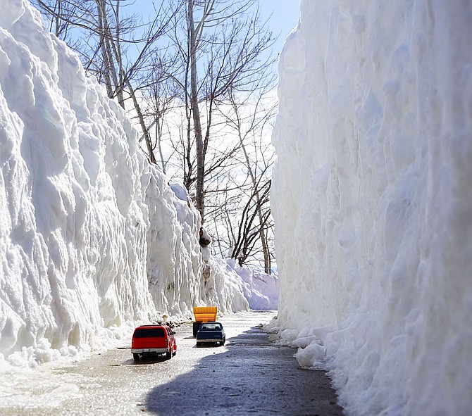 We admit that on first look, we were tricked by this photo taken by Topaz Ranch Estates resident John Flaherty. It turns out they're toy cars on his walk and the snow is actually around 4 feet on either side. It's a cool image, and the Nevadan in us can't resist joining John in having a little fun with it.